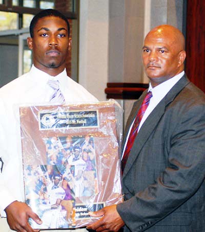 T.J. Yeldon of Daphne displays his 2011 Mr. Football award with Alvin Briggs, Director of the Alabama High School Athletic Directors & Coaches Association. (Photo special to AHSAA)
