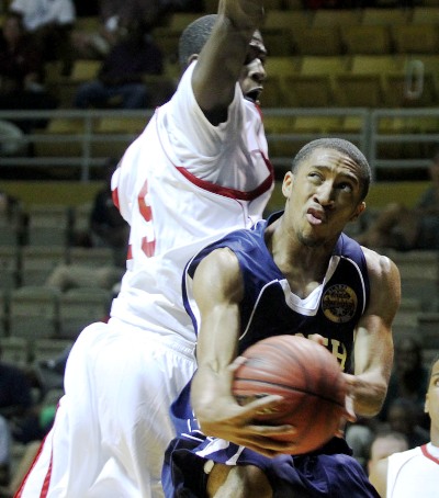 North's Nigel Whatley of Wenonah drives on Aimal Hayes of Dallas County.